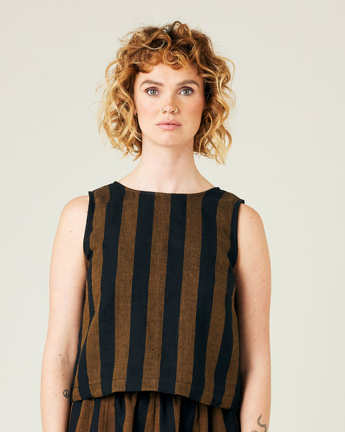 model wears rust stripe linen esme top