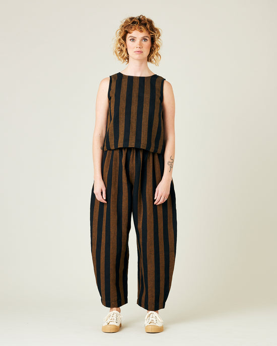 model wears rust stripe linen mabel trousers