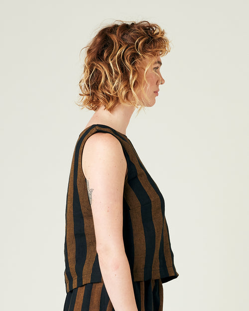 model wears rust stripe linen esme top