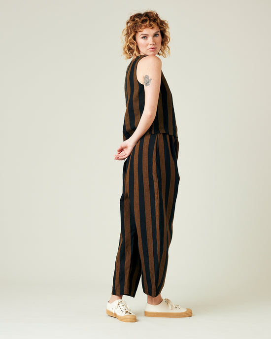 model wears rust stripe linen mabel trousers