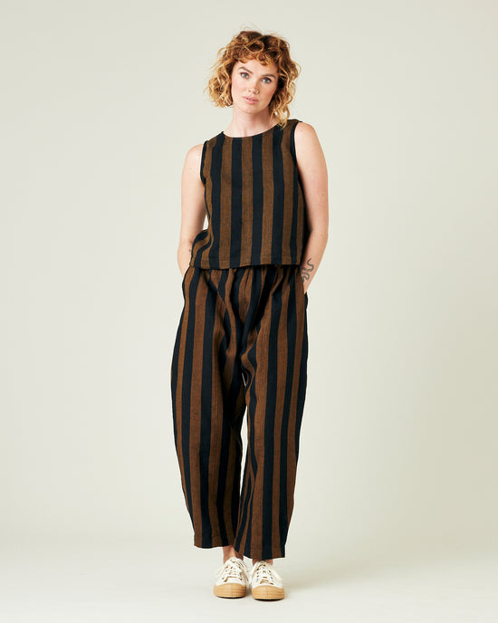 model wears rust stripe linen mabel trousers