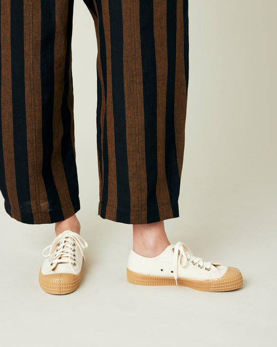 model wears rust stripe linen mabel trousers