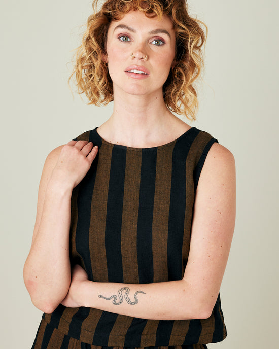 model wears rust stripe linen esme top