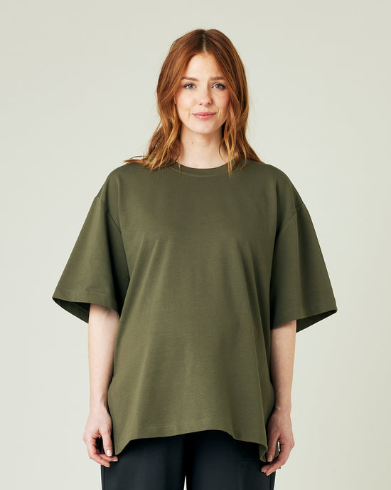 pregnant model wears olive jersey jude top