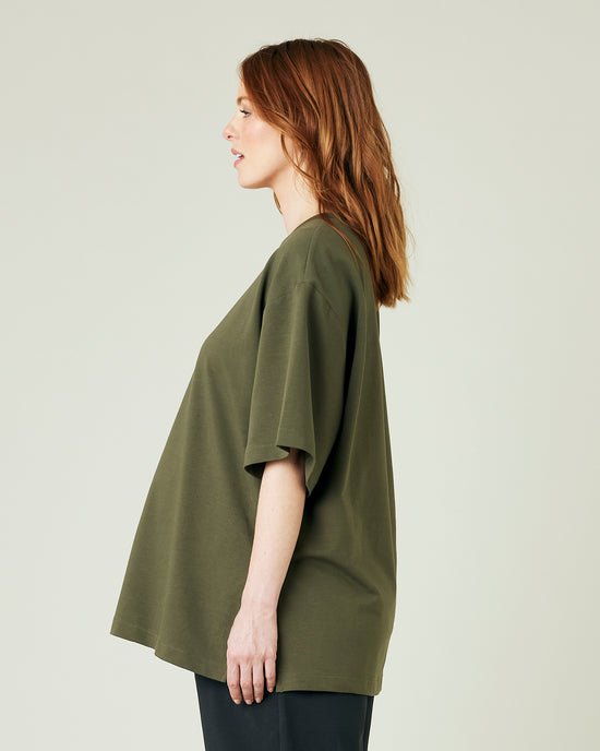 pregnant model wears olive jersey jude top