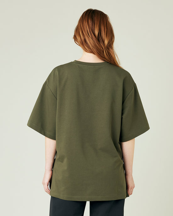 pregnant model wears olive jersey jude top