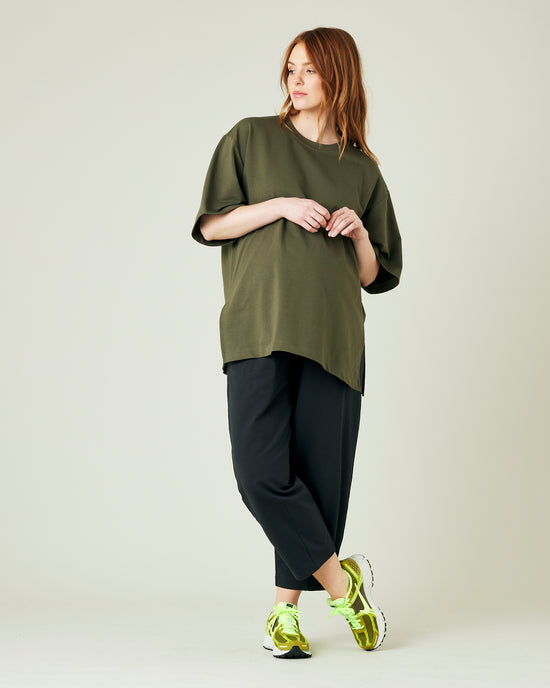 pregnant model wears olive jersey jude top