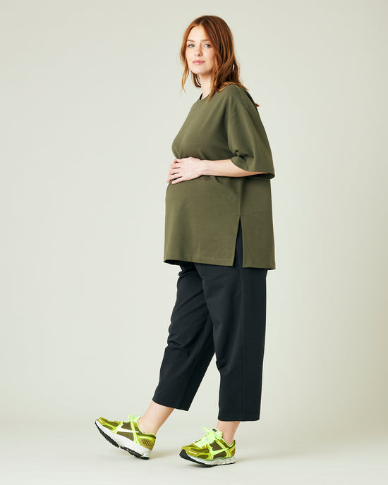 pregnant model wears olive jersey jude top