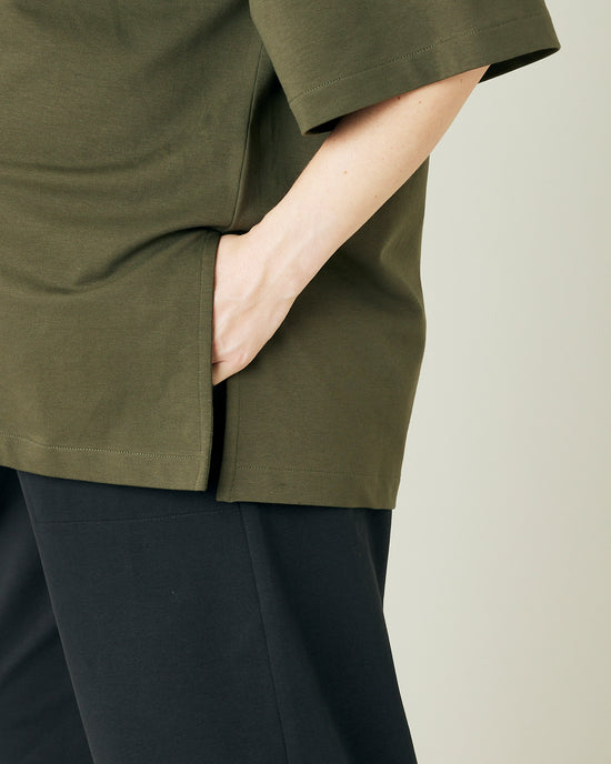 pregnant model wears olive jersey jude top