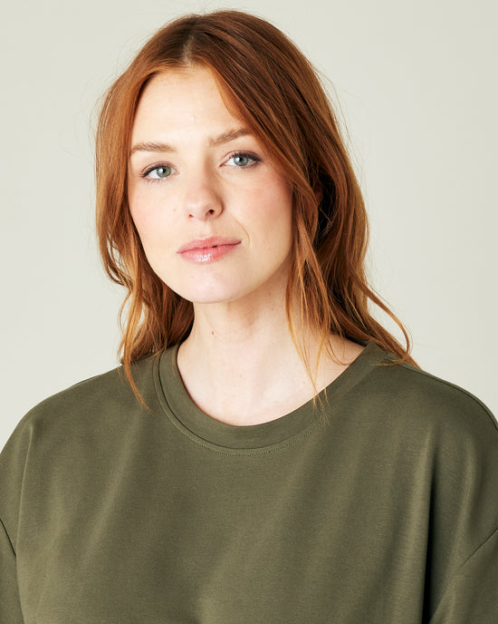 pregnant model wears olive jersey jude top