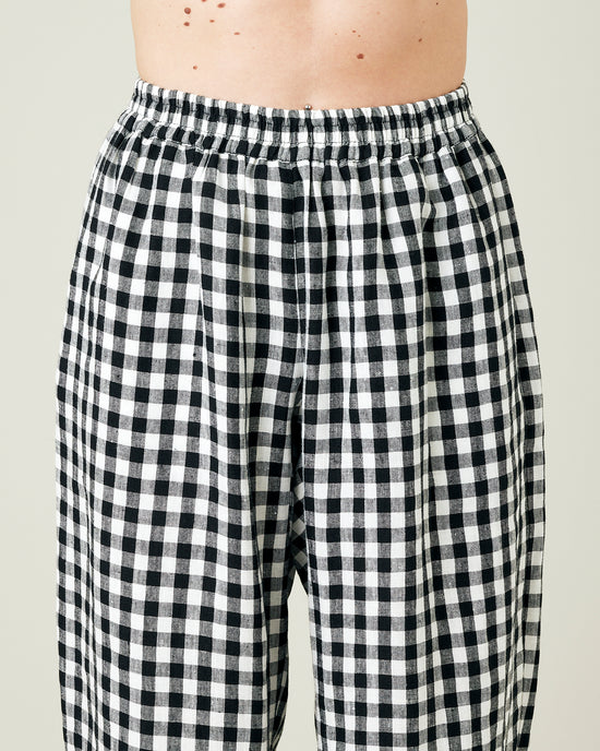 model wears black and white gingham ultimate pj linen trousers