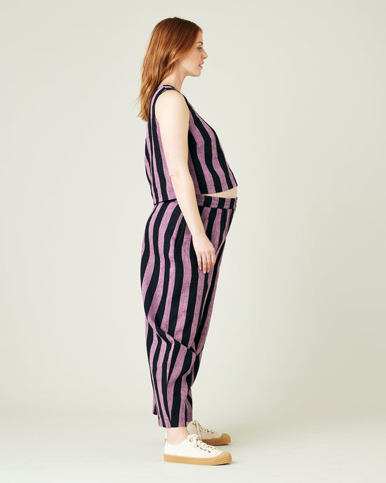 pregnant model wears pink and black stripe linen mabel trousers