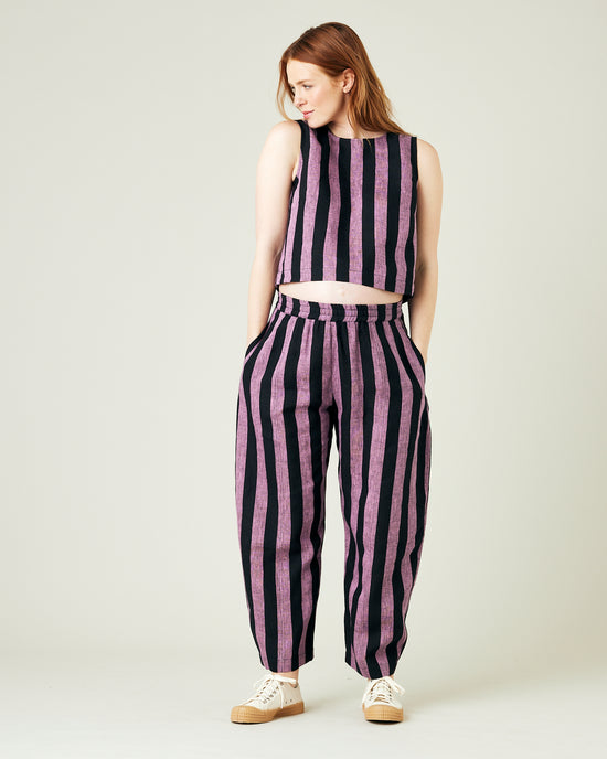 pregnant model wears pink and black stripe linen mabel trousers