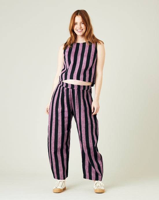 pregnant model wears pink and black stripe linen mabel trousers