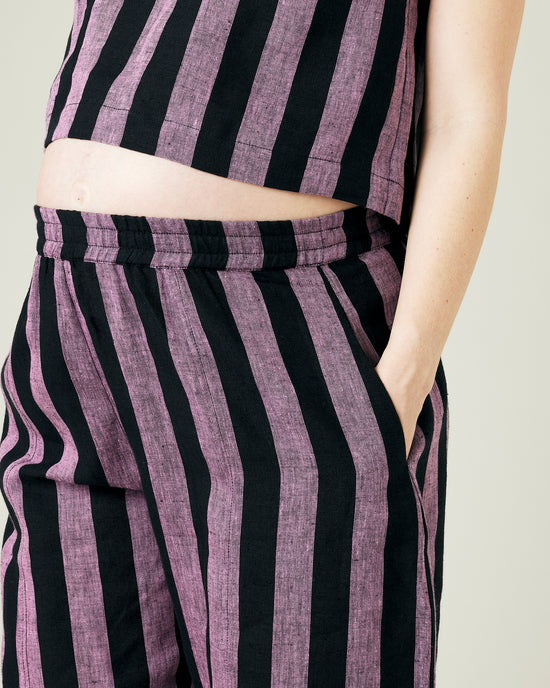 pregnant model wears pink and black stripe linen mabel trousers