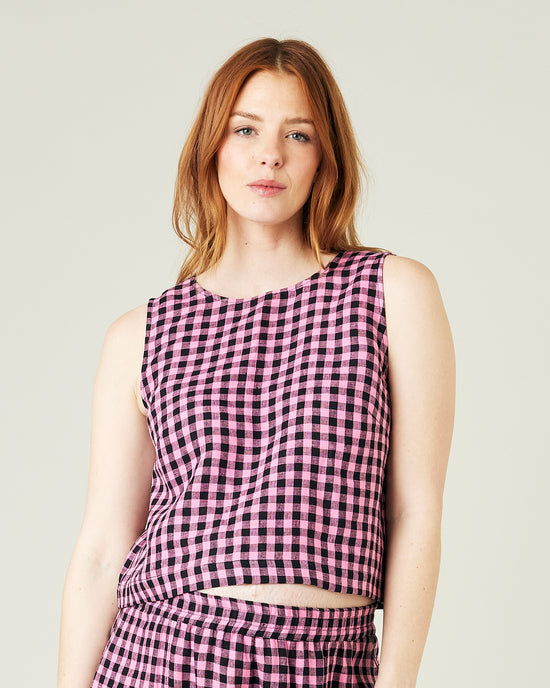 pregnant model wears pink and black check linen esme top