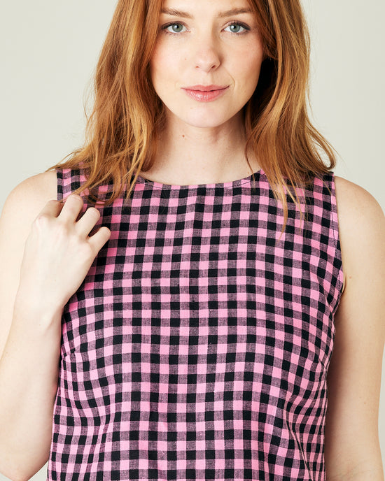 pregnant model wears pink and black check linen esme top