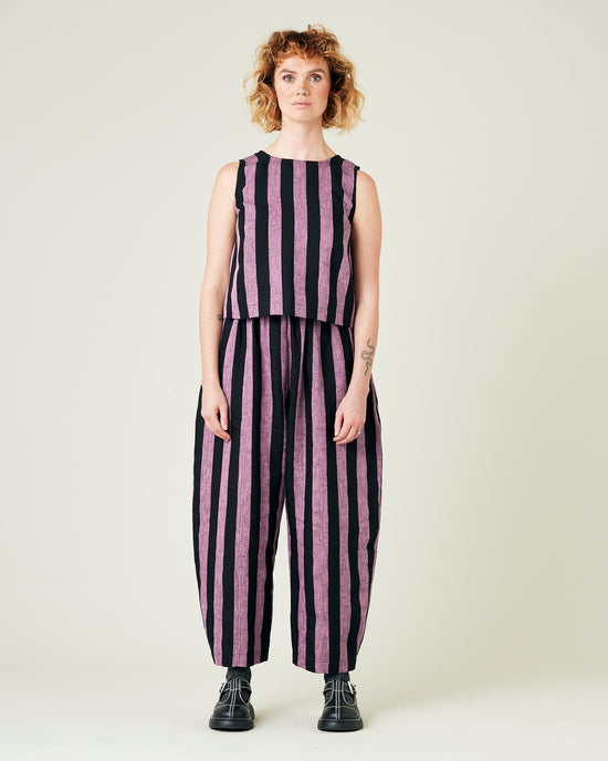 model wears pink and black stripe linen mabel trousers