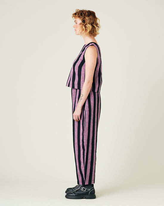 model wears pink and black stripe linen mabel trousers