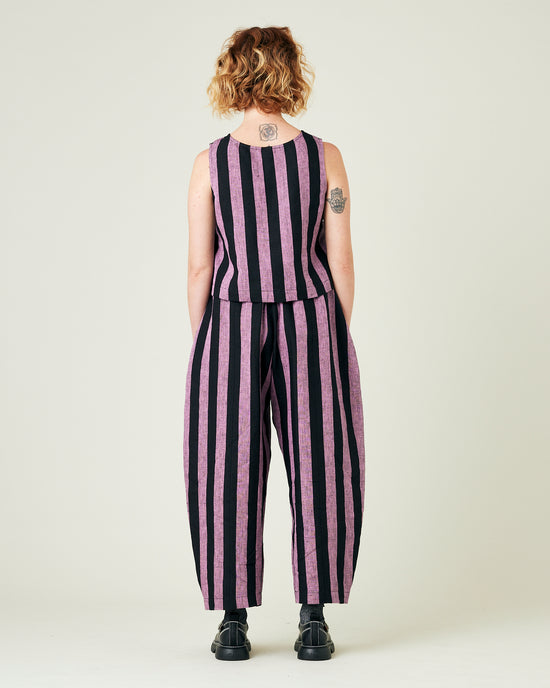 model wears pink and black stripe linen mabel trousers