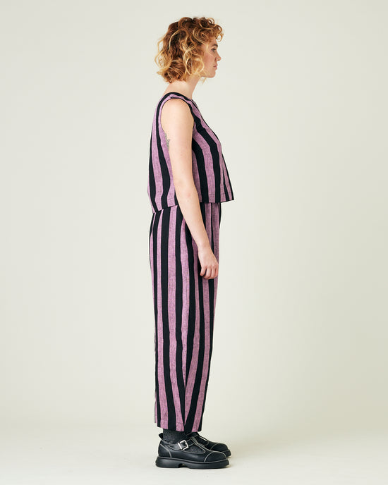 model wears pink and black stripe linen mabel trousers