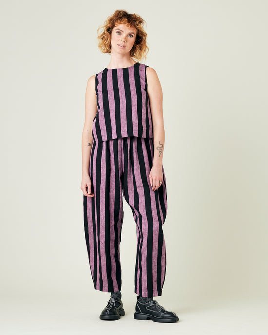 model wears pink and black stripe linen mabel trousers