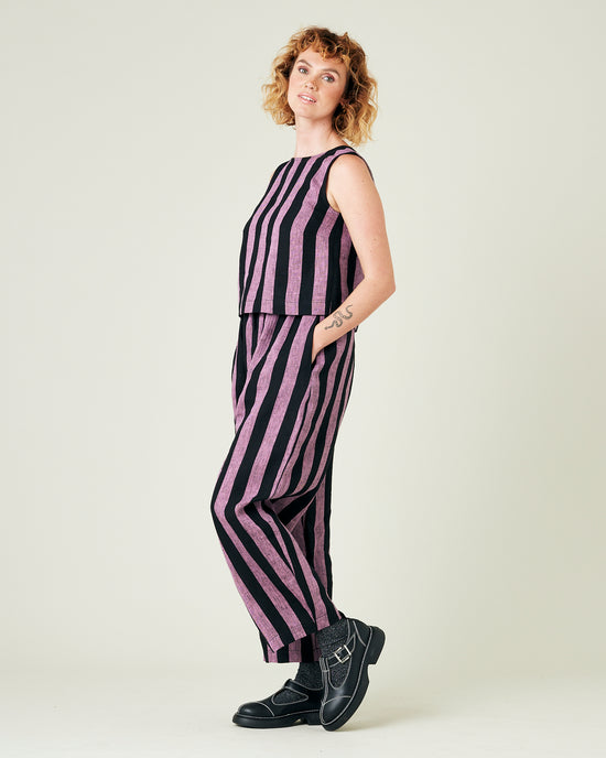 model wears pink and black stripe linen mabel trousers