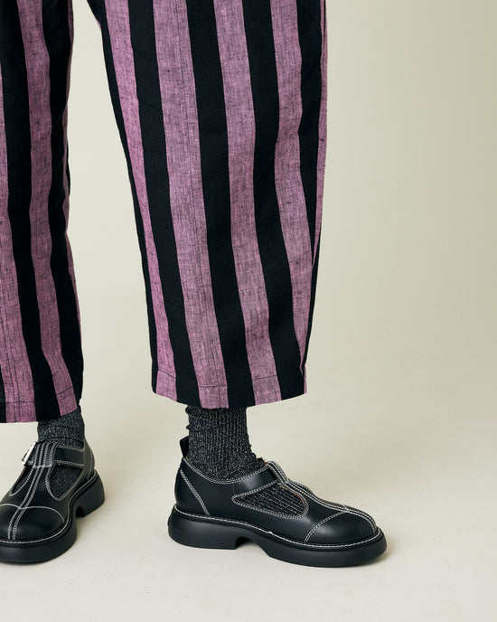 model wears pink and black stripe linen mabel trousers