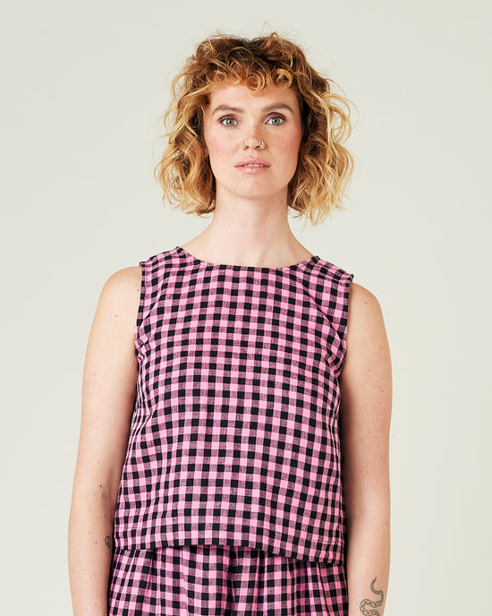 model wears pink and black check linen esme top