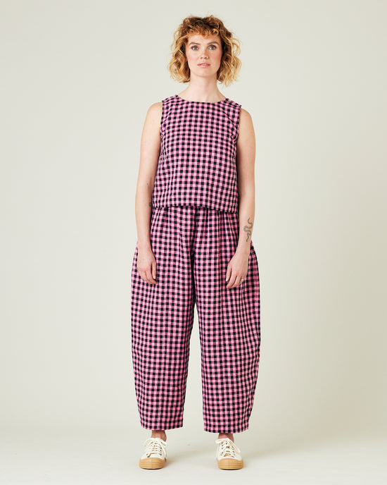 model wears pink and black check linen esme top