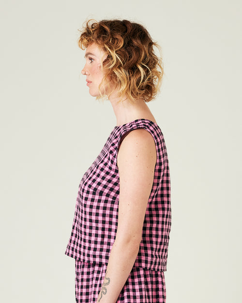 model wears pink and black check linen esme top