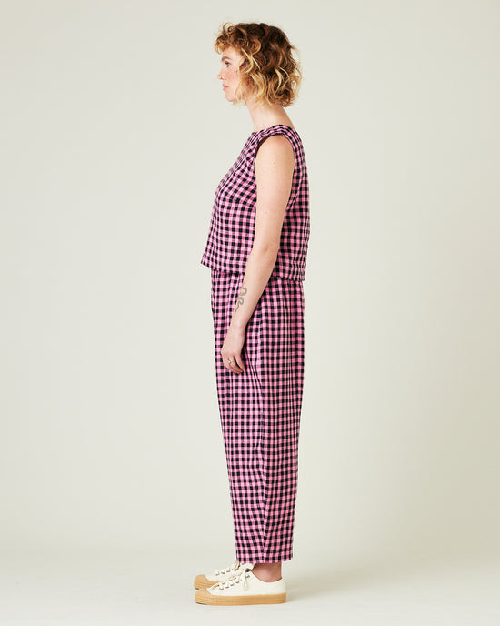 model wears pink and black gingham linen mabel trousers