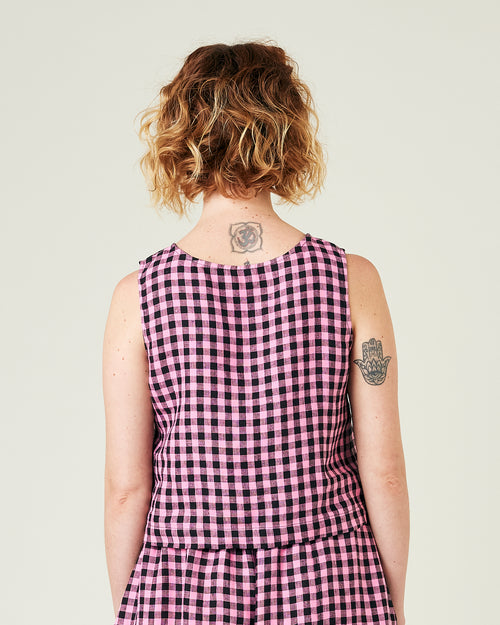 model wears pink and black check linen esme top