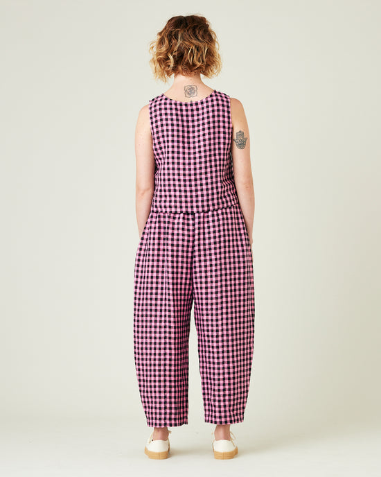 model wears pink and black gingham linen mabel trousers