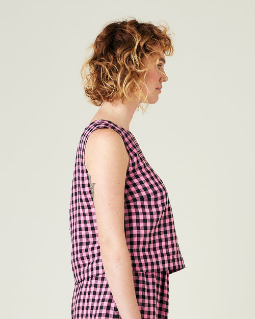 model wears pink and black check linen esme top