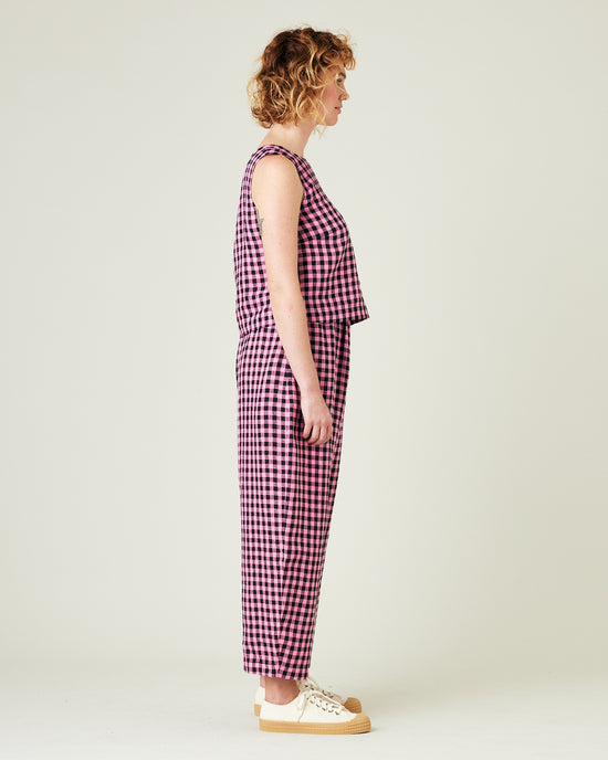 model wears pink and black gingham linen mabel trousers