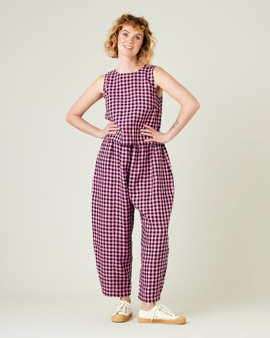 model wears pink and black gingham linen mabel trousers