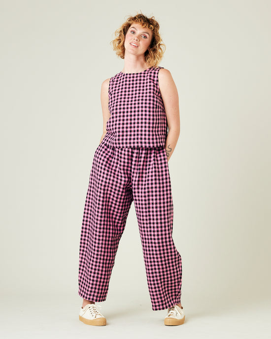 model wears pink and black check linen esme top