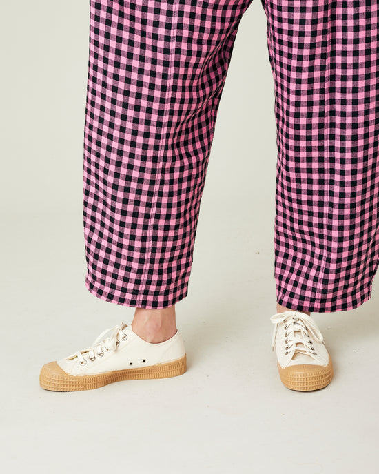 model wears pink and black gingham linen mabel trousers