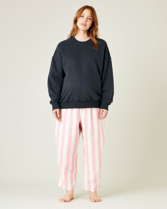 pregnant model wears pink and ecru stripe ultimate pj linen trousers