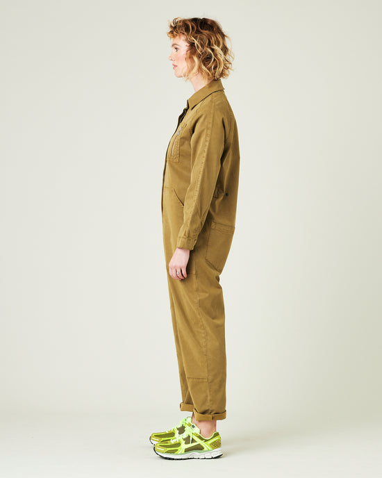 model wears nut green hallie jumpsuit