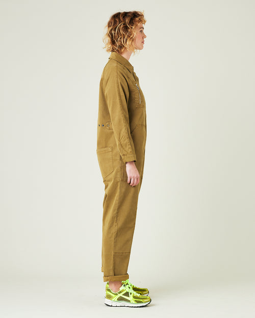 model wears nut green hallie jumpsuit