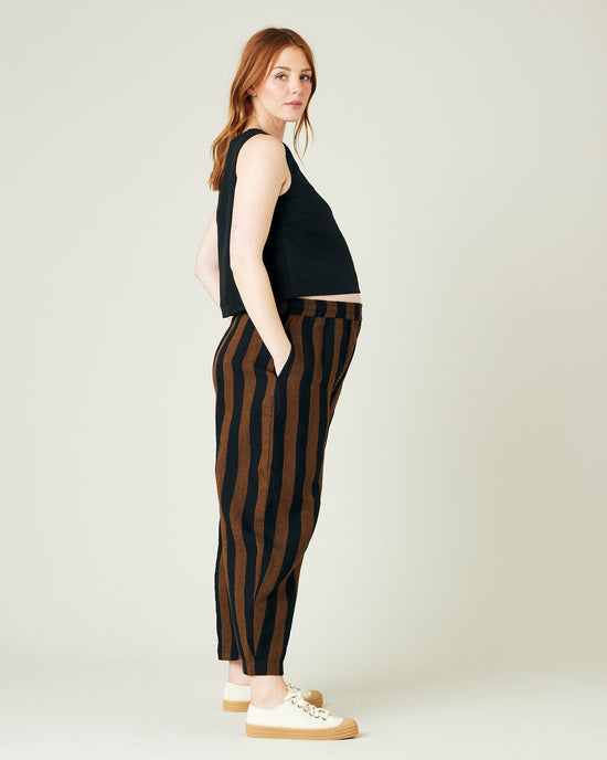 pregnant model wears rust stripe linen mabel trousers