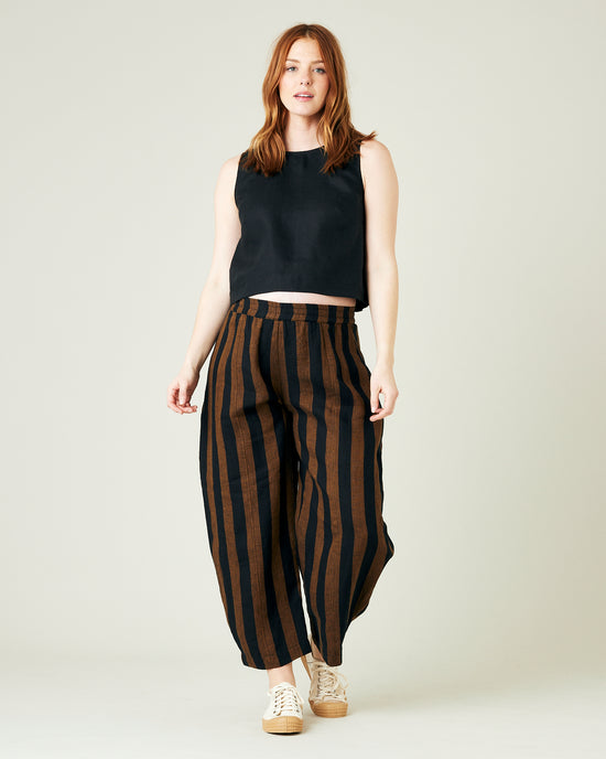 pregnant model wears rust stripe linen mabel trousers