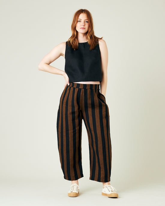 pregnant model wears rust stripe linen mabel trousers