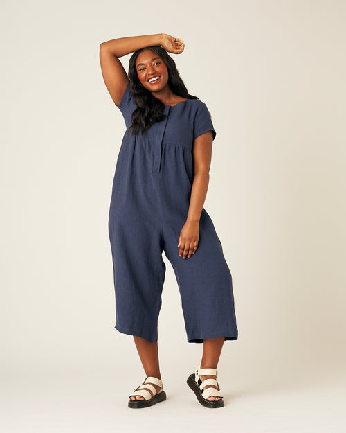 model wears navy linen sahara jumpsuit