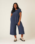 model wears navy linen sahara jumpsuit