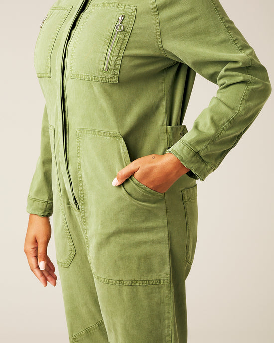 model wears moss green hallie jumpsuit