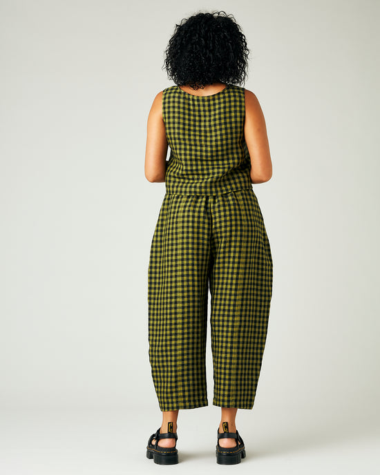 model wears green gingham linen mabel trousers