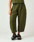 model wears green gingham linen mabel trousers from the front